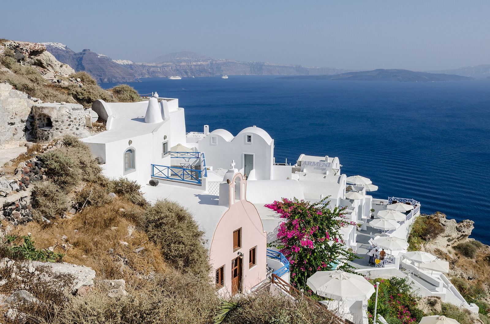 White houses of Oia stepping down the Santorini caldera